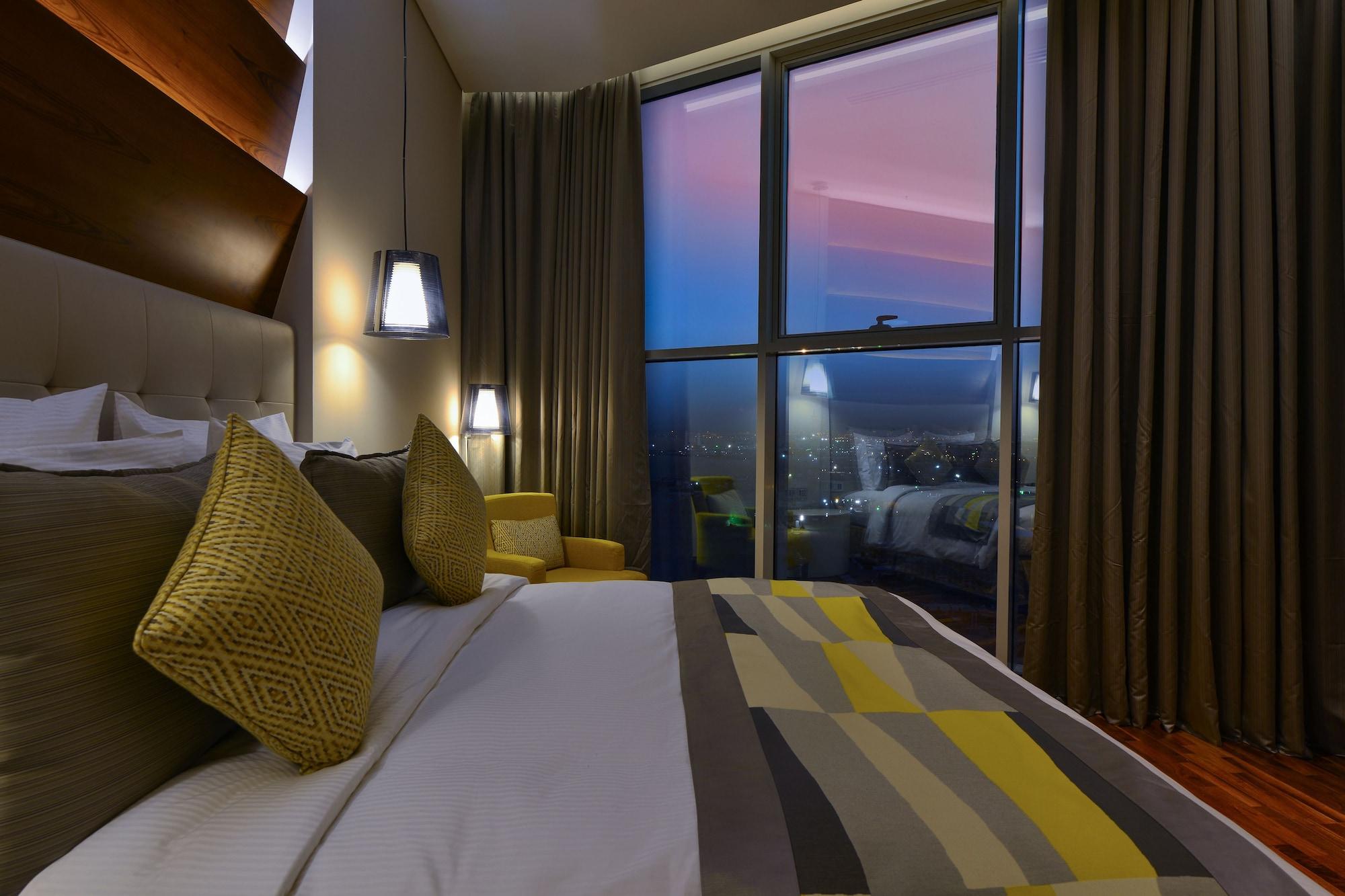 The Avenue Hotel Doha Exteriör bild A bedroom at the hotel