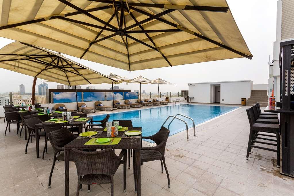 The Avenue Hotel Doha Exteriör bild Rooftop pool at the hotel