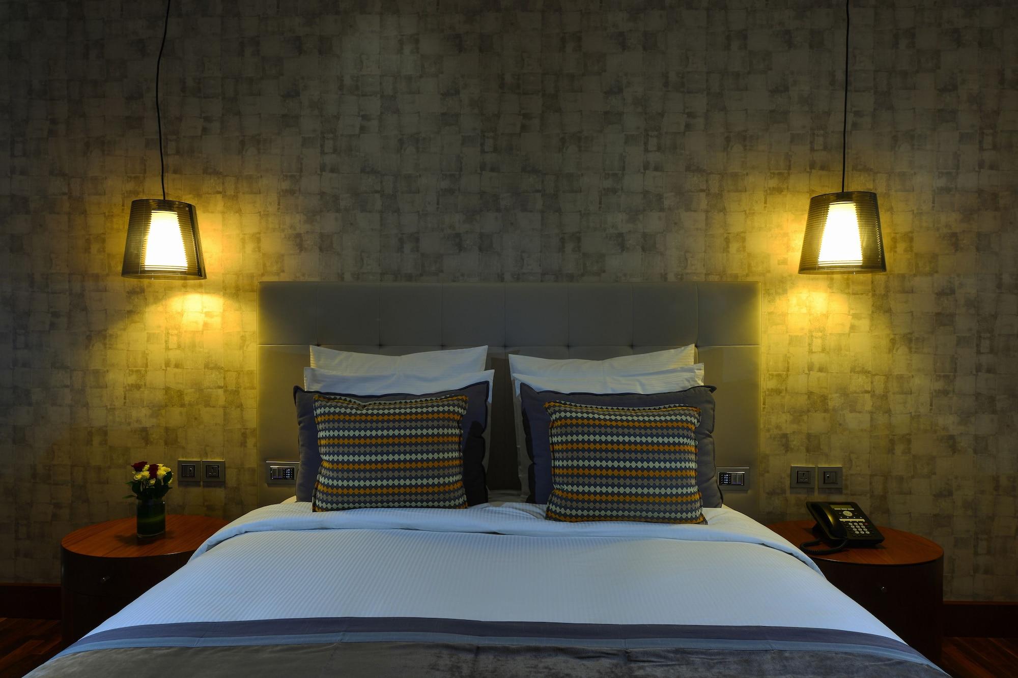 The Avenue Hotel Doha Exteriör bild A bedroom at the hotel