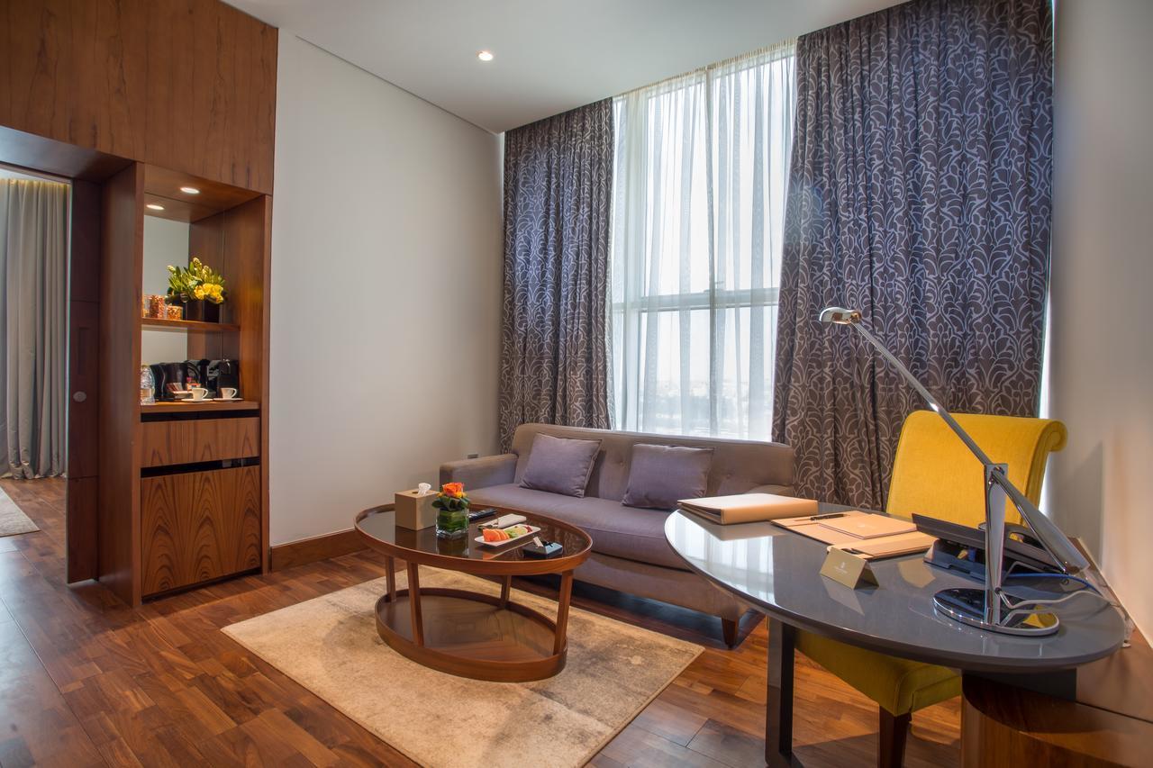 The Avenue Hotel Doha Exteriör bild A living room at the hotel